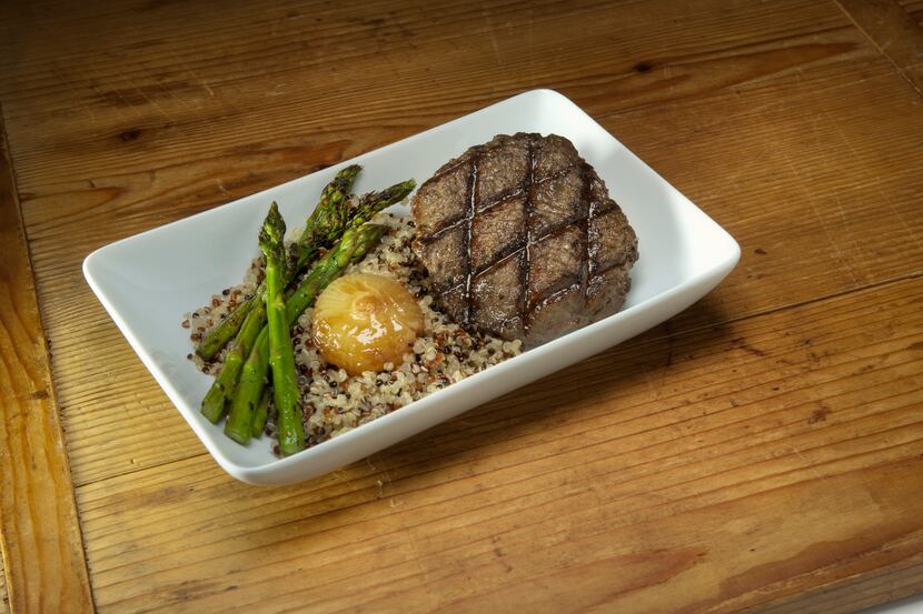 A peppercorn-crusted tenderloin with asparagus and quinoa is one of several dishes designed...