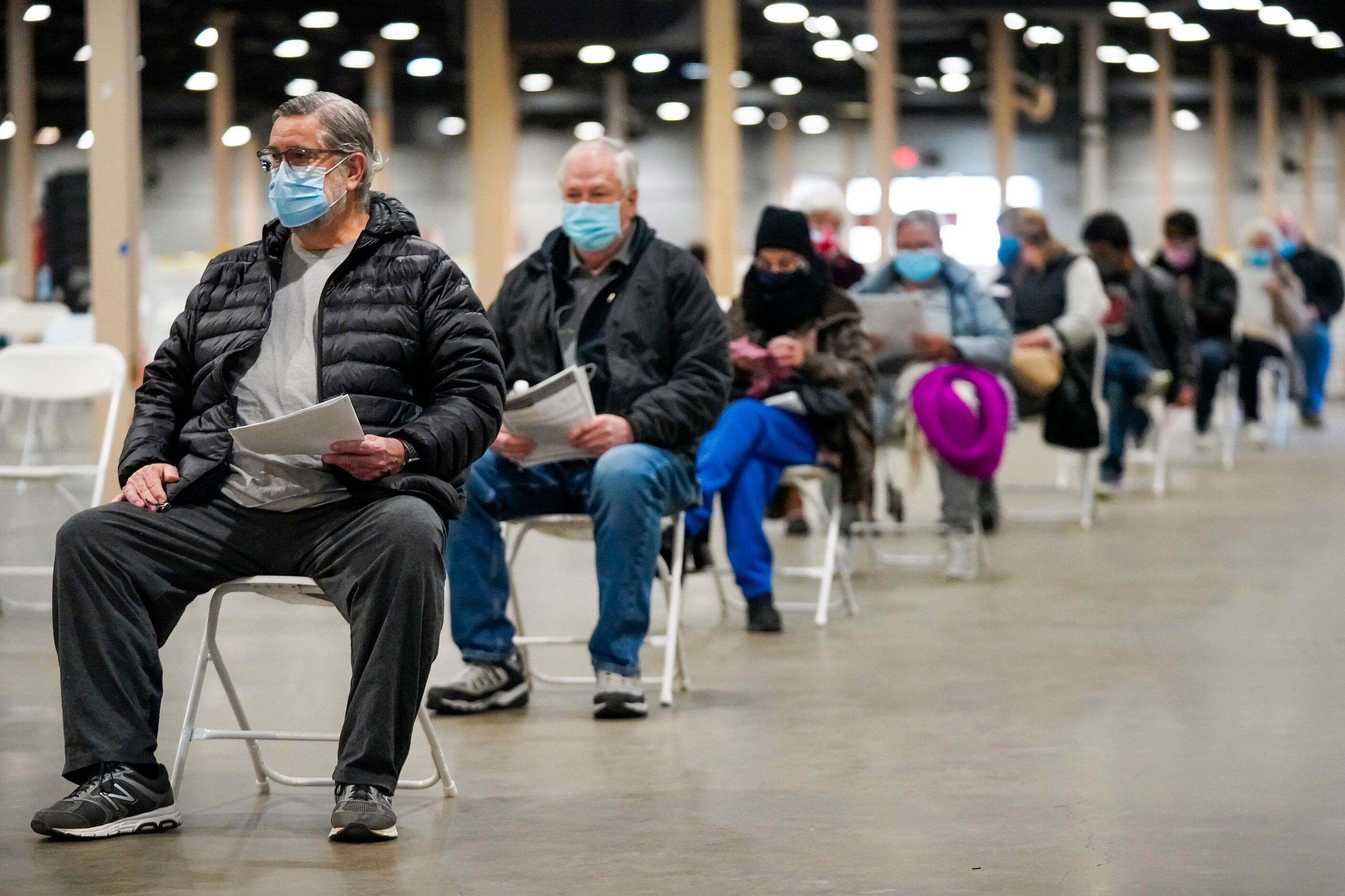 Davis Mosmeyer (left) waits at the front of the line to receive the COVID-19 vaccine at Fair...