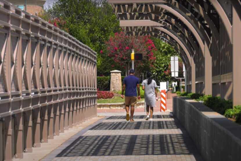A 10-foot wide canopied walkway on Legacy Road crosses over the Dallas North Tollway.