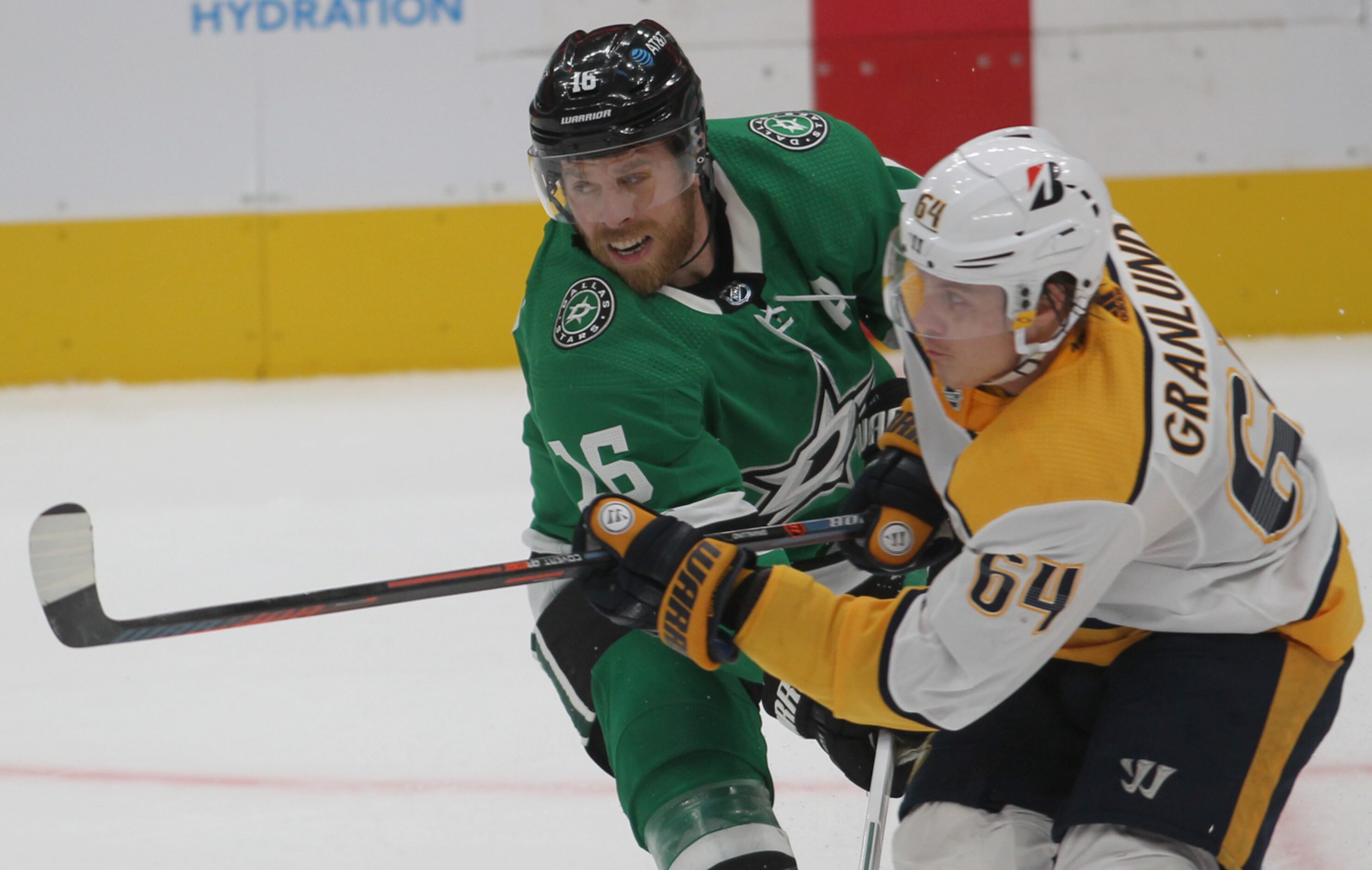 Dallas Stars' Joe Pavelski (16) tangles with Nashville Predators' Mikael Granlund (64)...