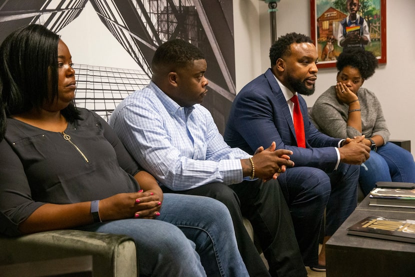 Attorney Lee Merritt (in suit) represents Atatiana Jefferson's siblings (from left) Ashley...