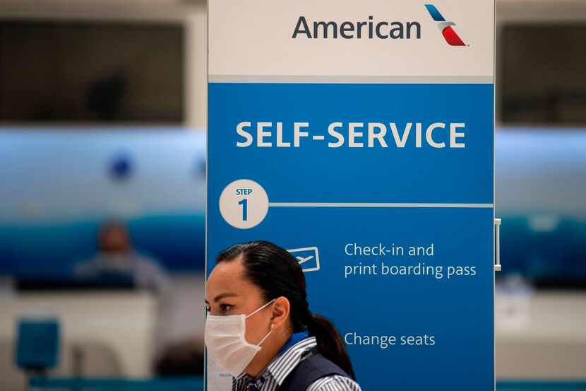 An American Airlines staffer waits for customers at the Benito Juarez International airport,...