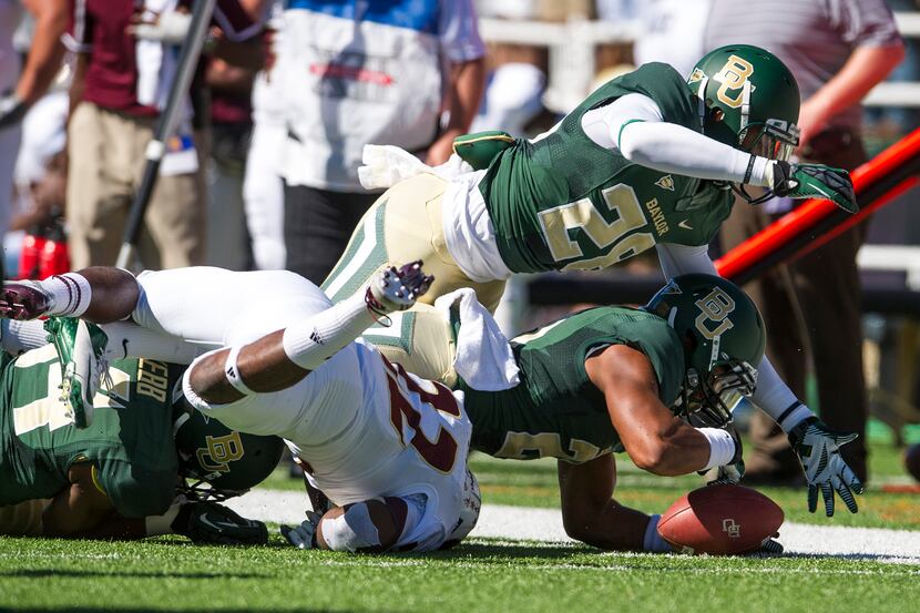Sep 21, 2013; Waco, TX, USA; Baylor Bears safety Patrick Levels (21) and safety Orion...
