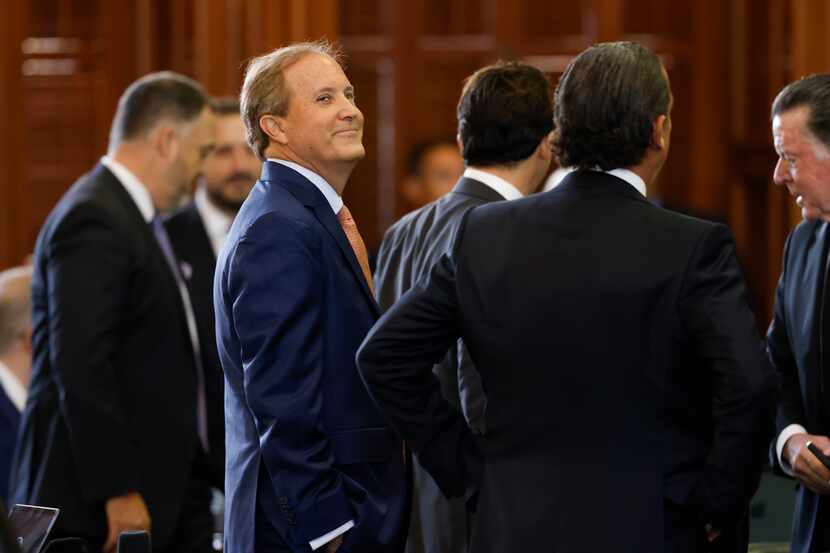Texas Attorney General Ken Paxton looks up at the gallery during the first day of his...