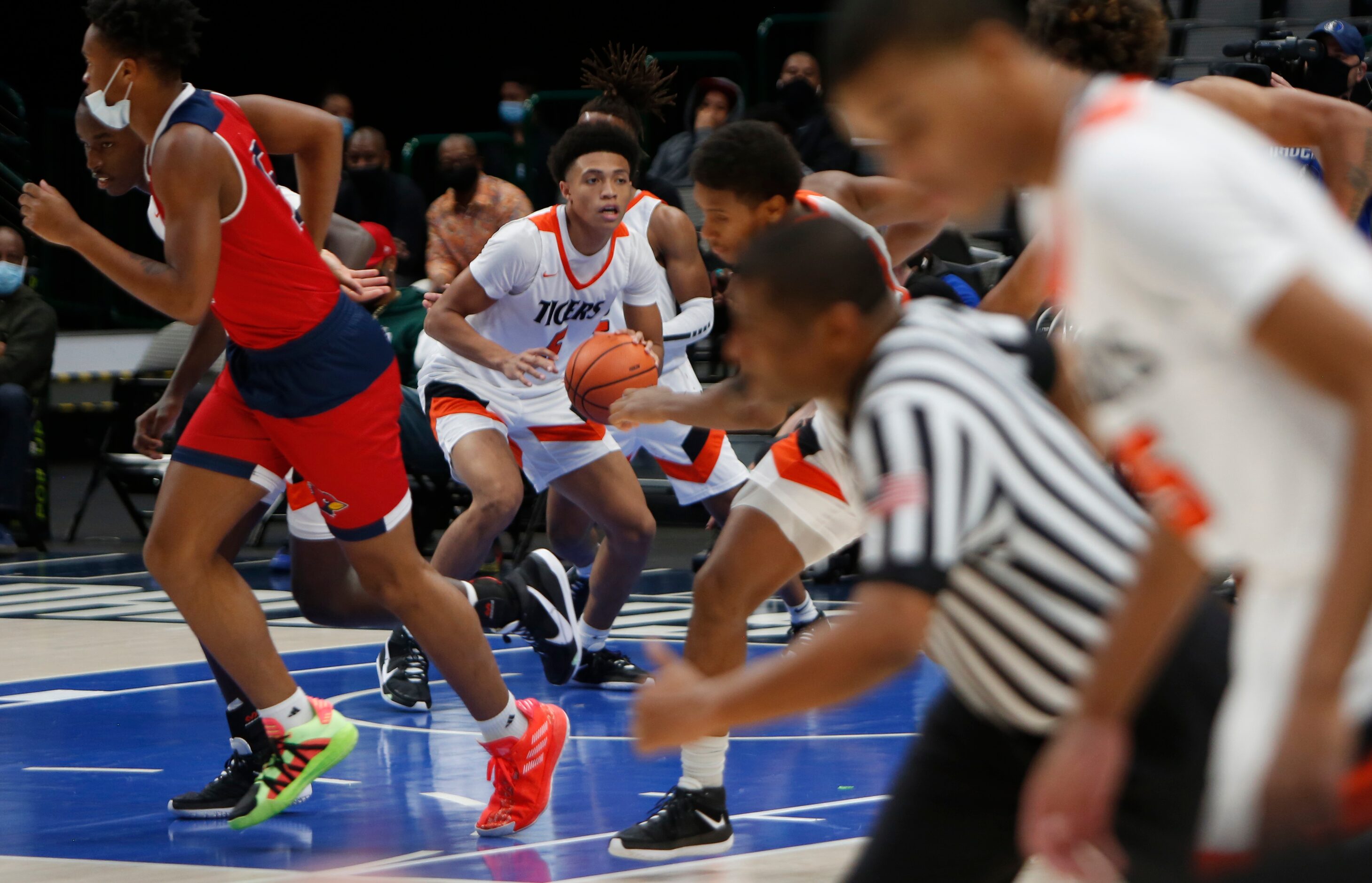 Lancaster's Elijah Hughey (5) waits for a wave of players and a game official to clear after...