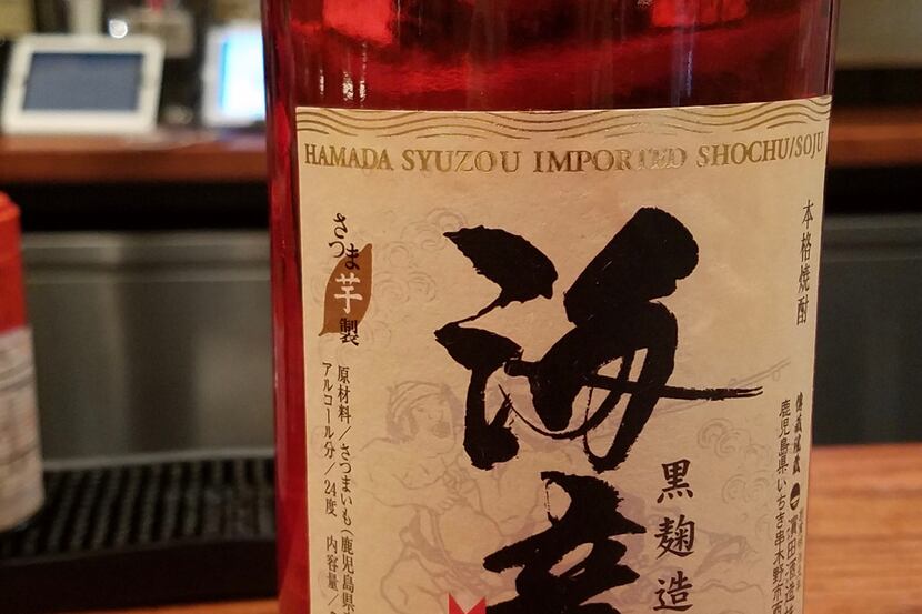 A bottle of sweet potato shochu served at Yayoi (since closed) in Plano, where bartender...