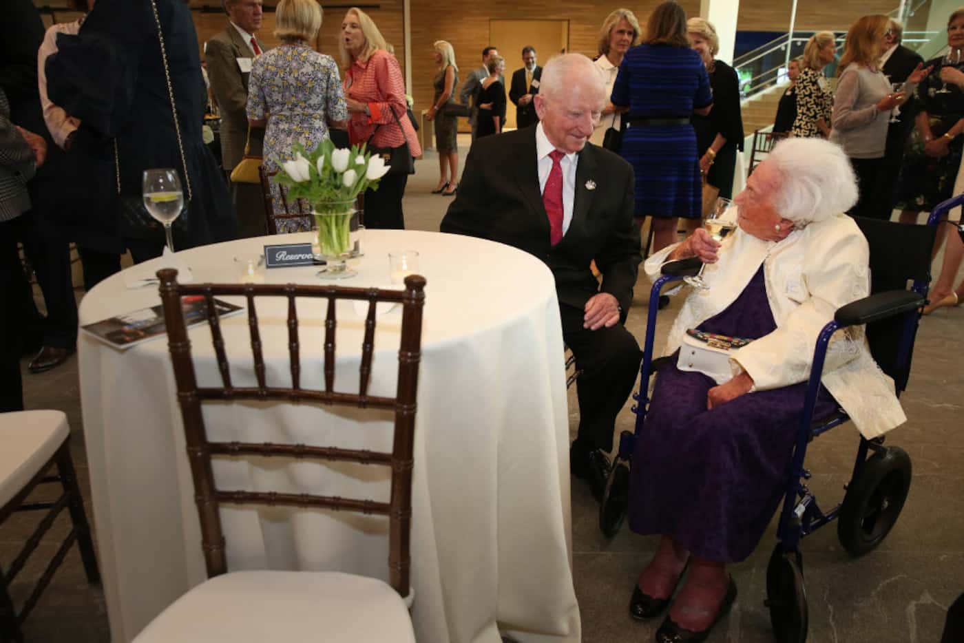 Ross Perot and Margaret McDermott  chat before a reception honoring philanthropist Ruth...
