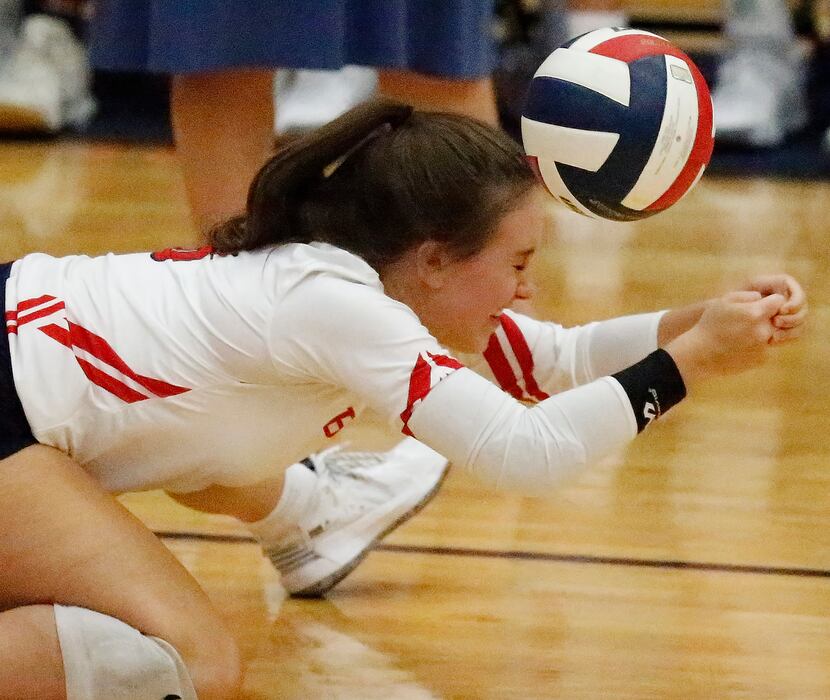 McKinney Boyd High School defensive specialist Claire Russell (8) was unable make the dig...