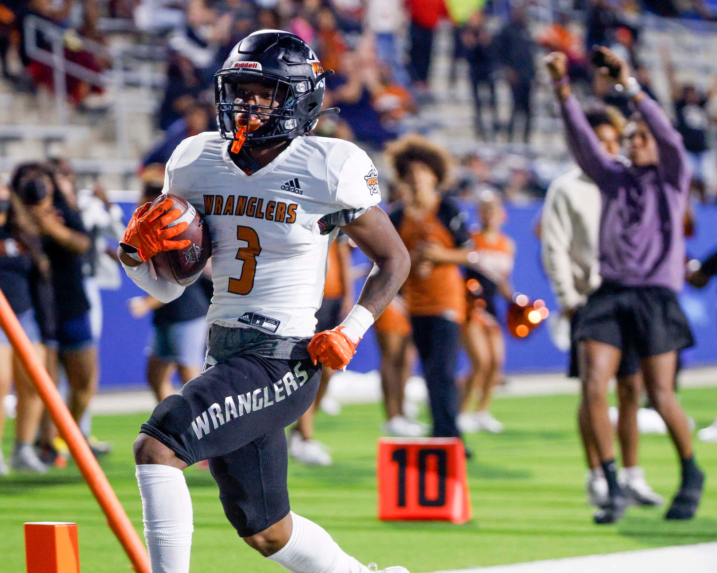West Mesquite’s Kasen McCoy (3) scores a touchdown during the first half of a high school...