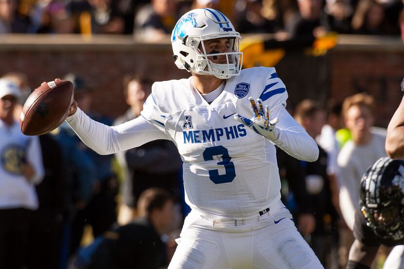 Memphis quarterback Brady White throws a pass during the first half of an NCAA college...