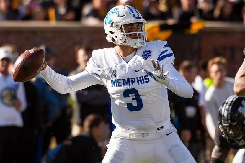 Memphis quarterback Brady White throws a pass during the first half of an NCAA college...