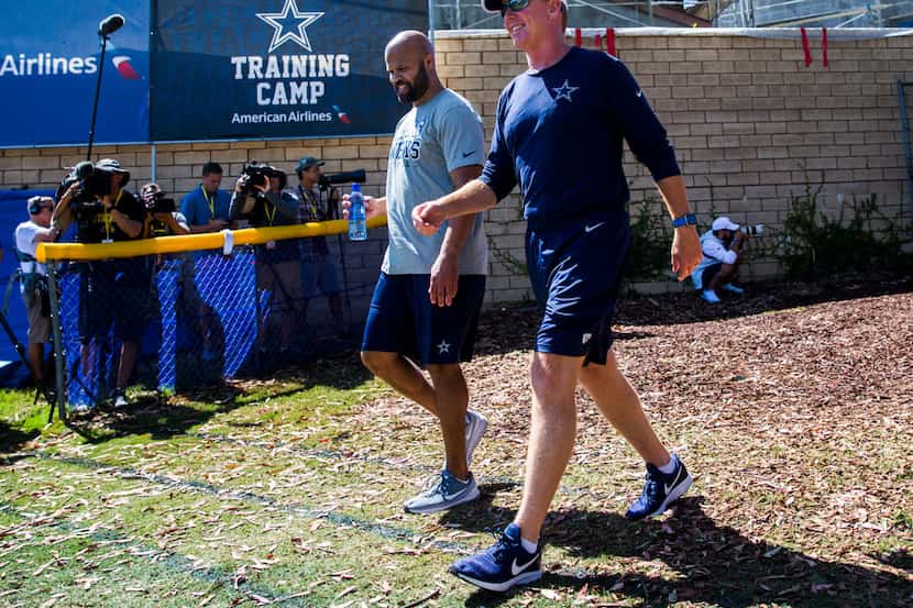 Dallas Cowboys head coach Jason Garrett and passing game coordinator and defensive backs...