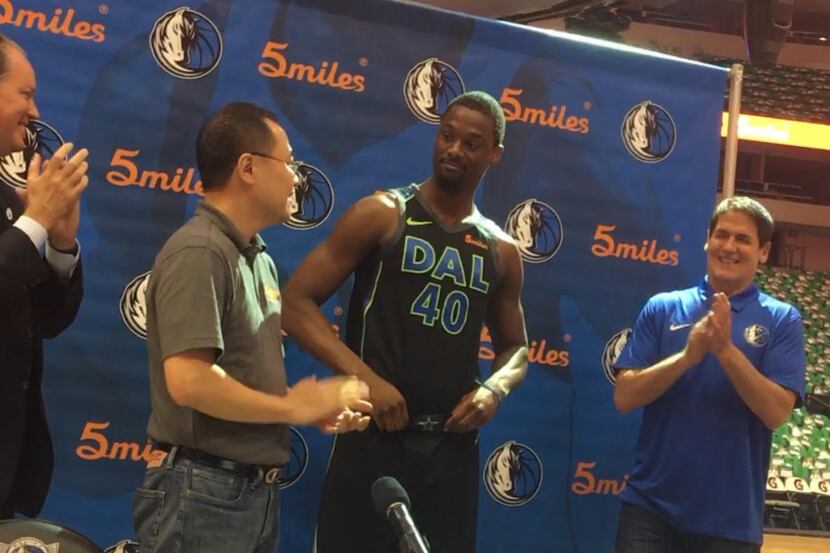 Mavericks forward Harrison Barnes models the team's jerseys featuring the new 5miles logo...