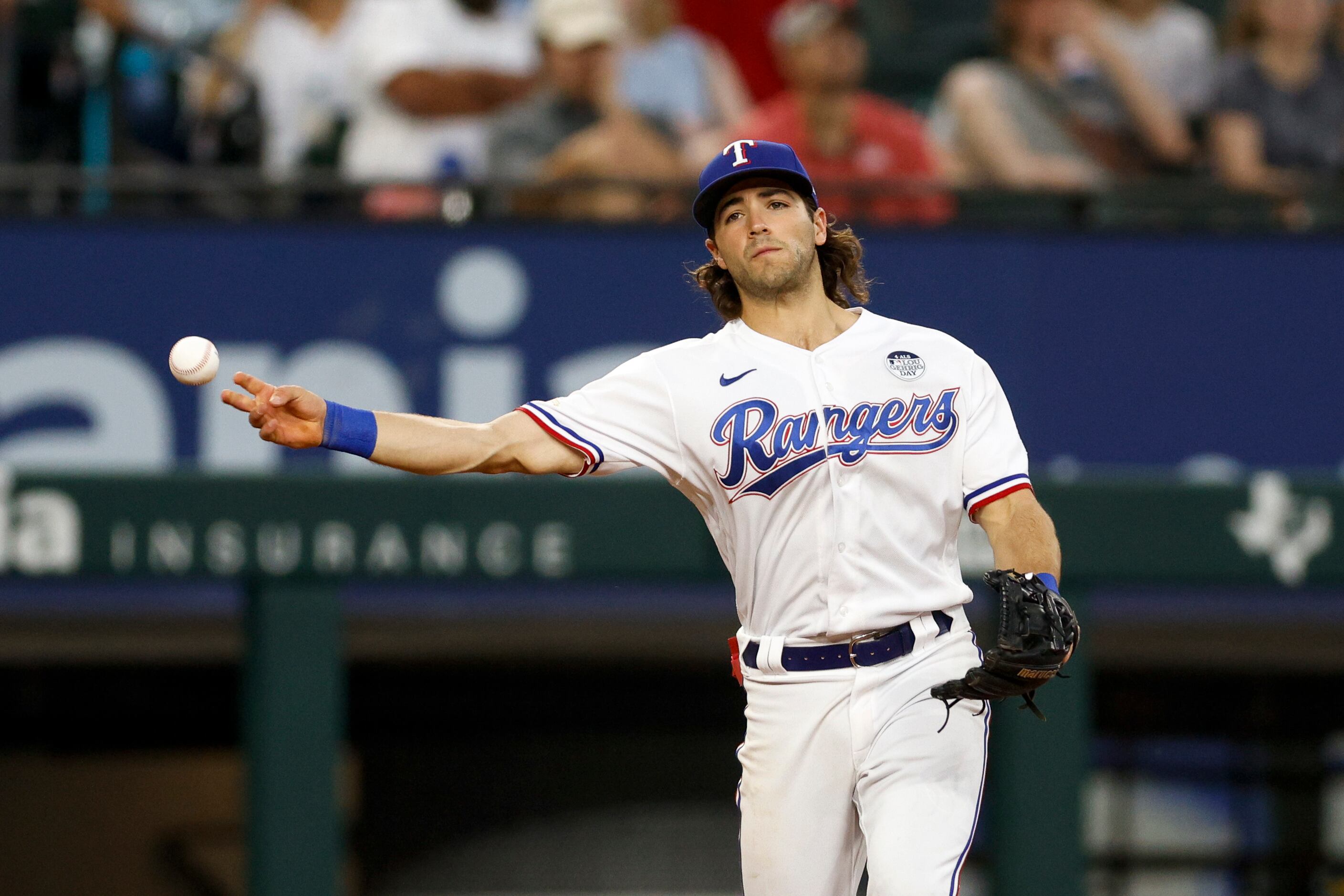 Texas Rangers' Josh Smith (47) celebrates in the dugout after