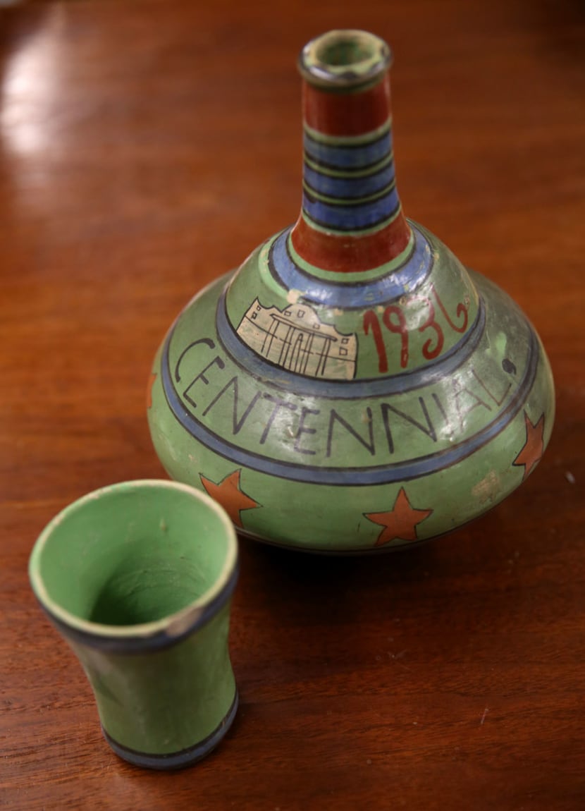 A hand-painted clay water jug souvenir from the Texas Centennial Exposition in 1936.