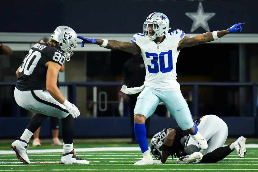 Dallas Cowboys safety Juanyeh Thomas (30) celebrates after breaking up a pass during the...