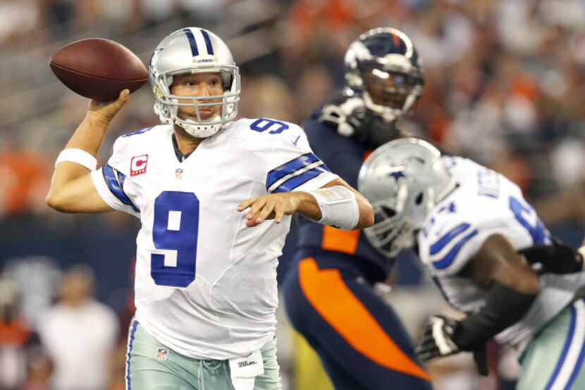 Dallas Cowboys quarterback Tony Romo (9) throws a fourth quarter pass against the Denver...