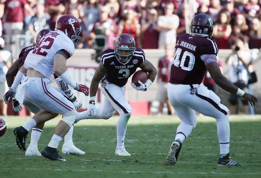 Texas A&M Aggies wide receiver Christian Kirk (3) returns a kickoff for a touchdown to make...