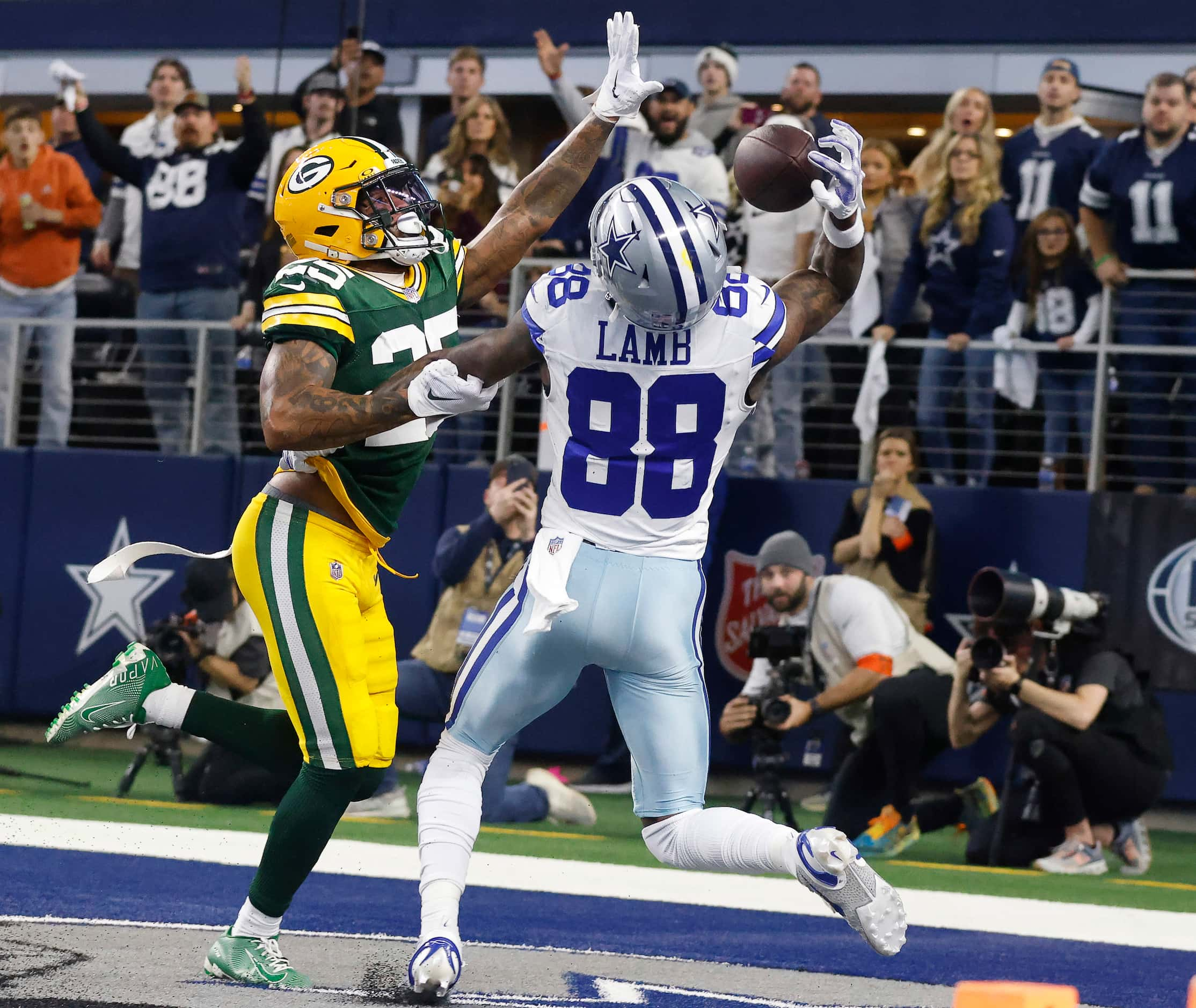 Dallas Cowboys wide receiver CeeDee Lamb (88) can’t corral a touchdown pass as he is...