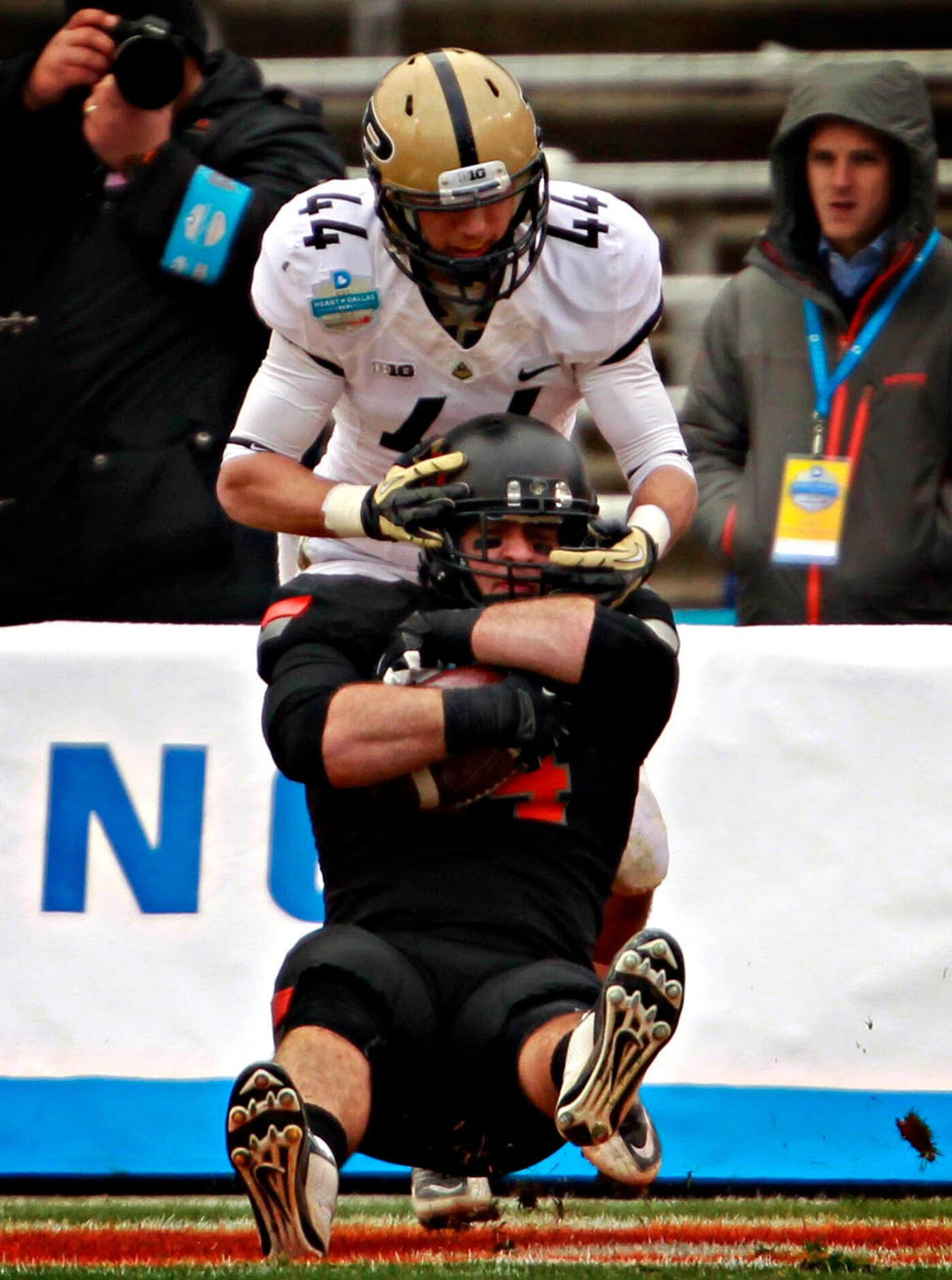 Purdue Boilermakers safety Landon Feichter (44) can't stop Oklahoma State Cowboys tight end...