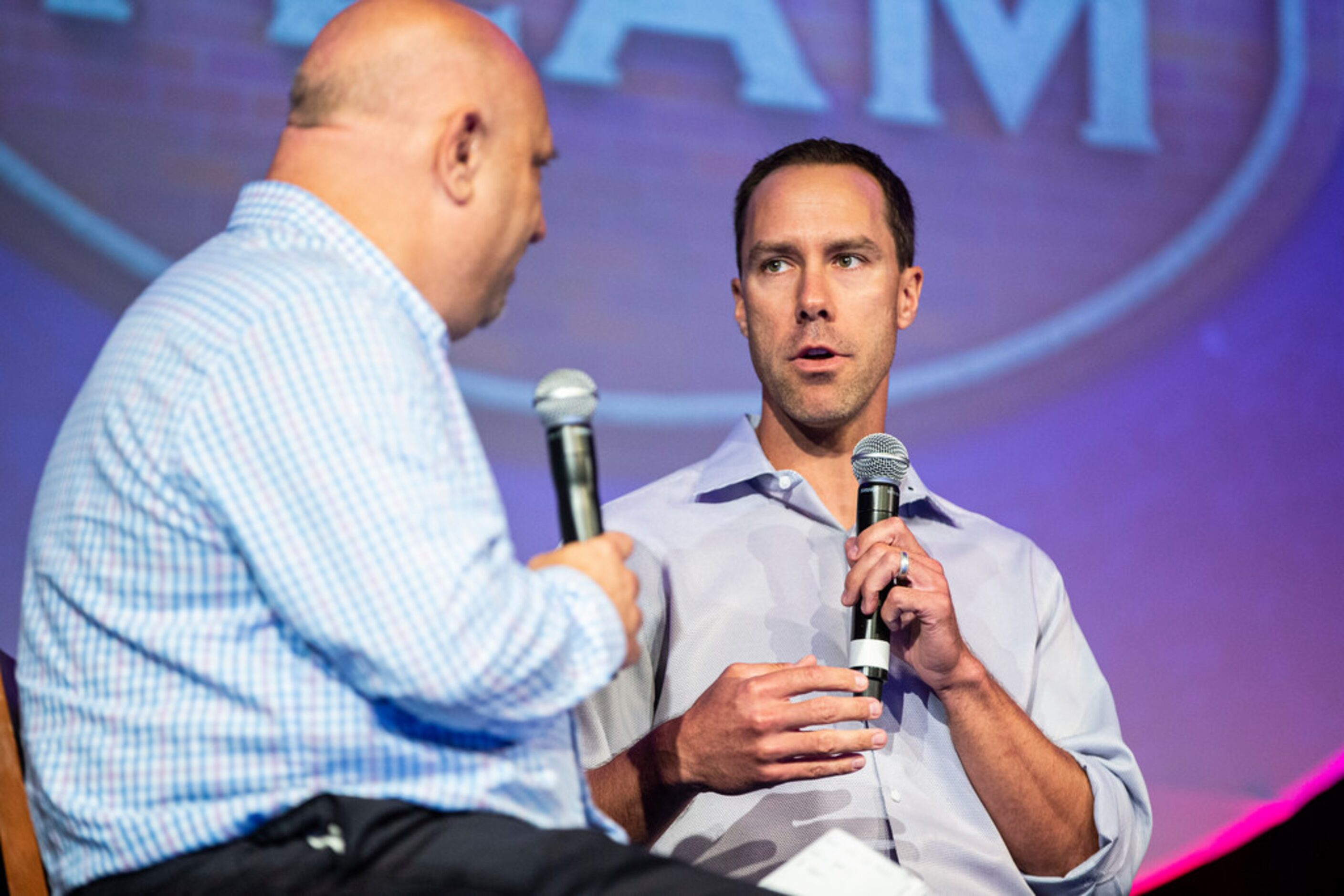 Texas Rangers beat writer for the Morning News Evan Grant, left, interviews former Texas...