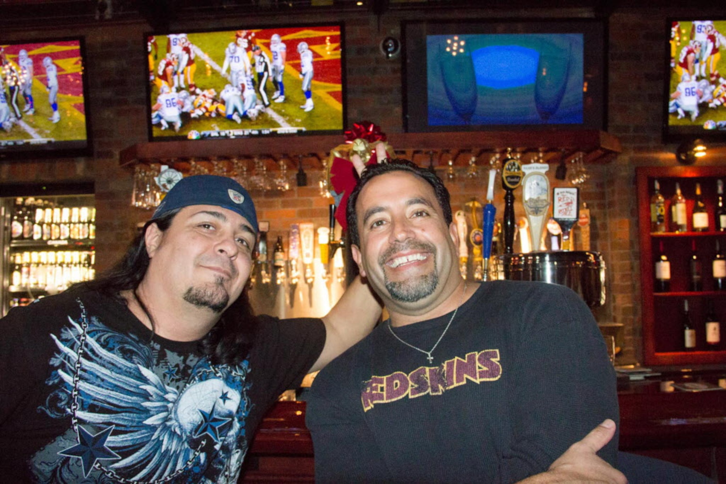 Friendly rivals Richard Salgado and Patrick Widner catch the Cowboy game at World of Beer on...