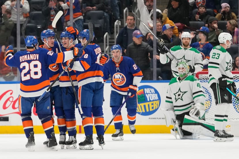 Dallas Stars goaltender Scott Wedgewood (41) reacts as the New York Islanders celebrates a...