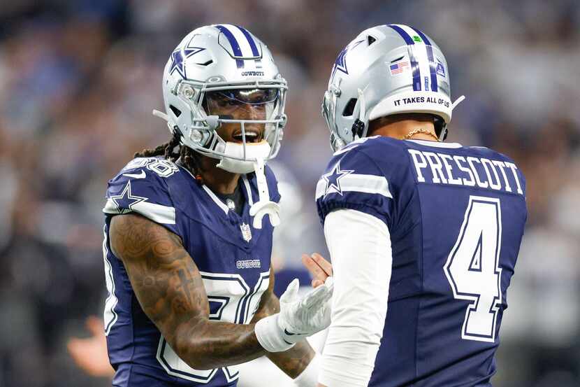 Dallas Cowboys wide receiver CeeDee Lamb (88) celebrates with quarterback Dak Prescott (4)...