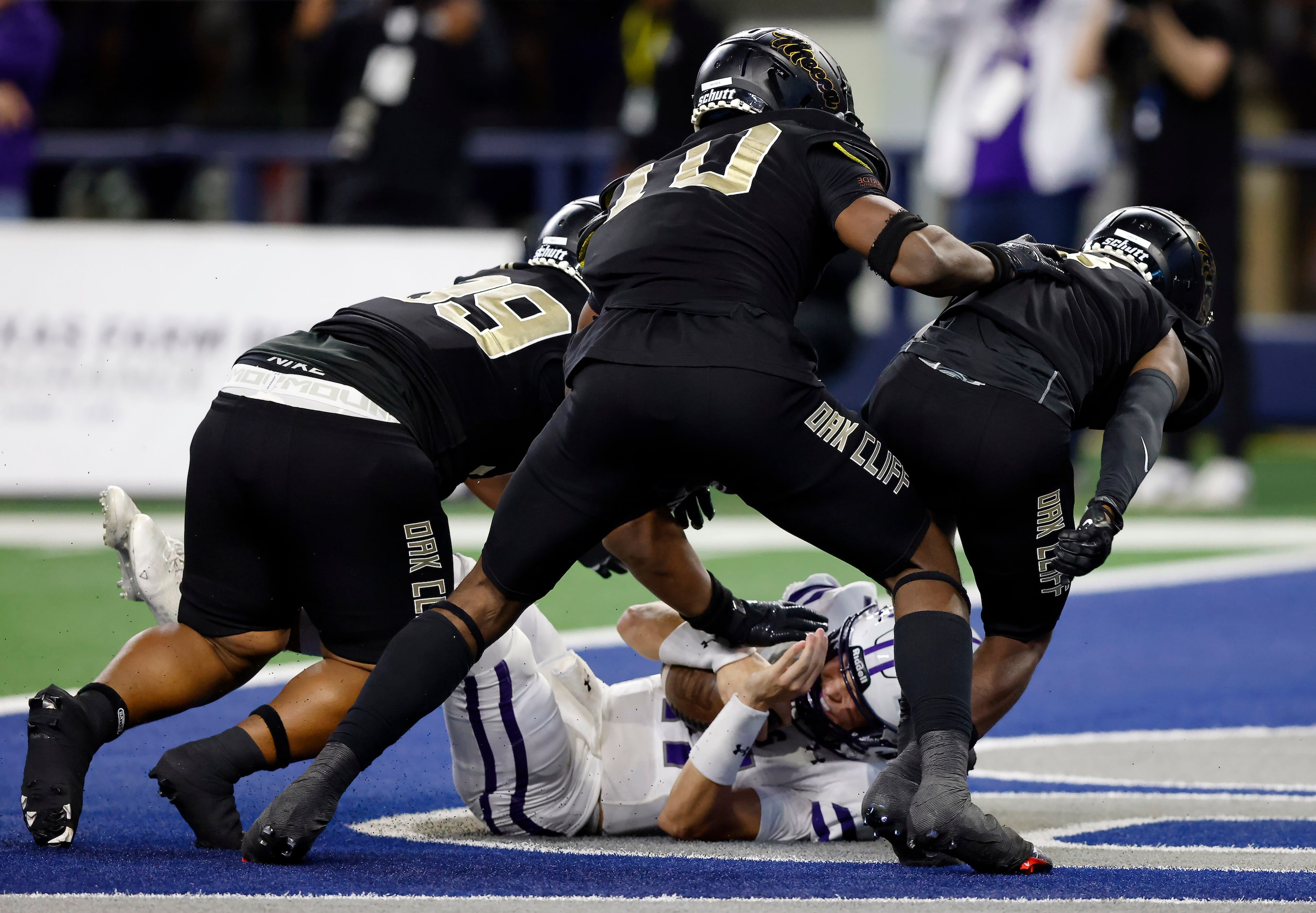 Port Neches-Grove quarterback Cole Crippen (11) is sacked in the end zone for a second...