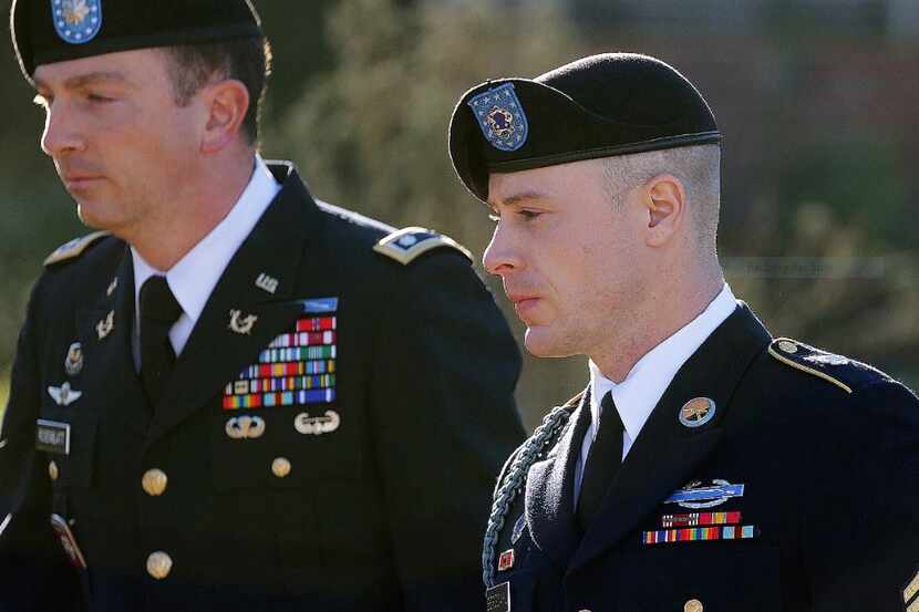  Army Sgt. Bowe Bergdahl, right, arrives for a pretrial hearing at Fort Bragg, N.C., with...
