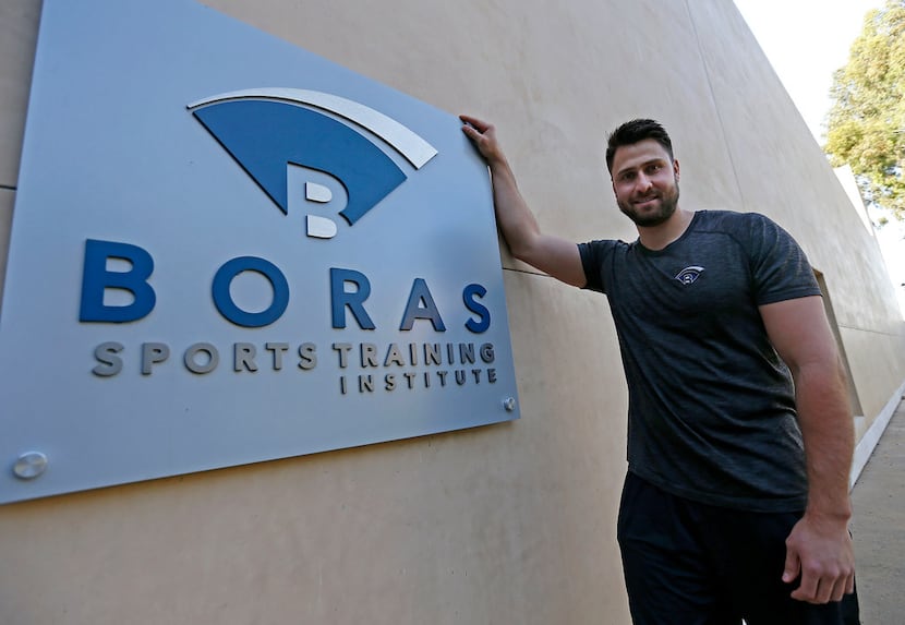 Texas Rangers first baseman Joey Gallo poses for a photograph with a sign of Boras Sports...