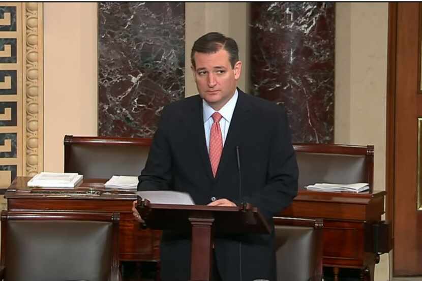  Sen. Ted Cruz speaks on Senate floor on Nov. 19, 2015. He was rebuked by Democrats after...