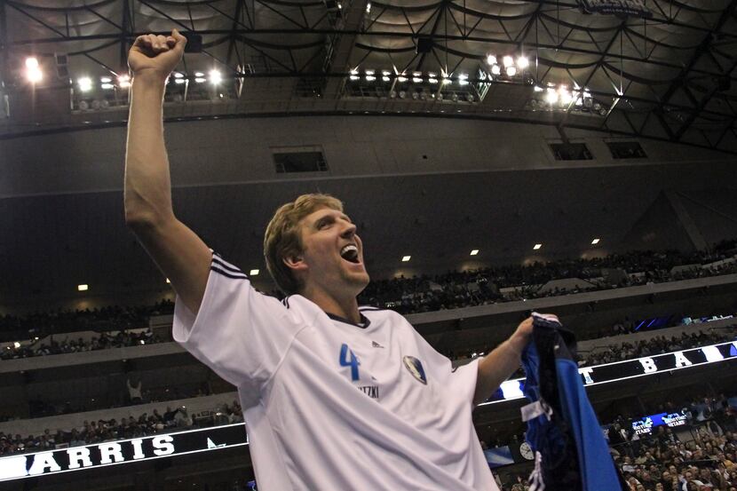 Dallas' Dirk Nowitzki celebrates after winning the "Shooting Stars" competition during NBA...