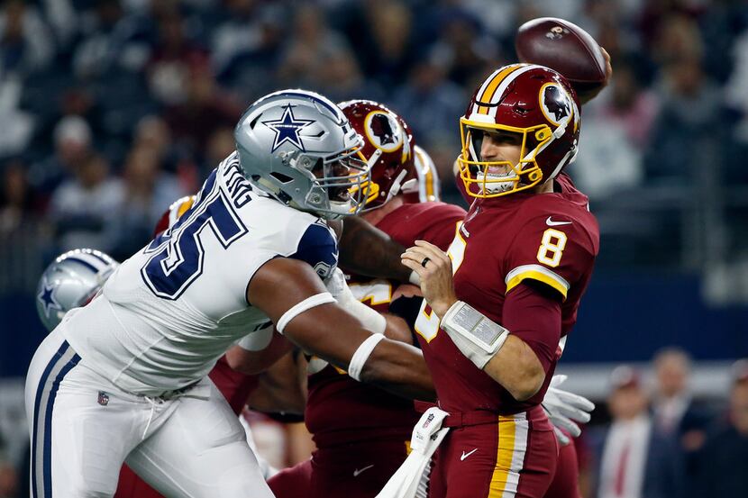 Dallas Cowboys defensive tackle David Irving (95) pressures Washington Redskins quarterback...