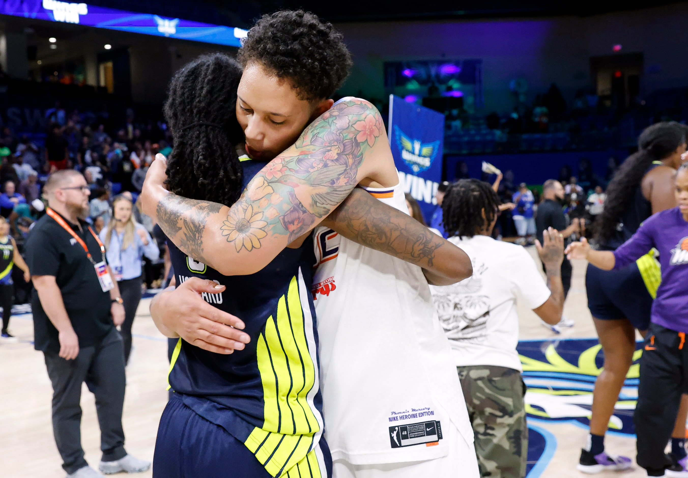 Phoenix Mercury center Brittney Griner (42) congratulates Dallas Wings forward Natasha...