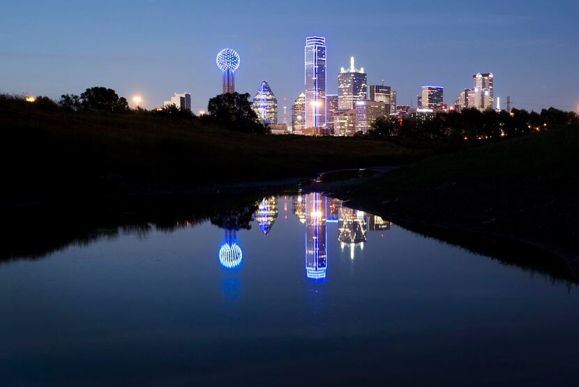 The downtown Dallas skyline lights up in blue in recognition of National Police Week on May...