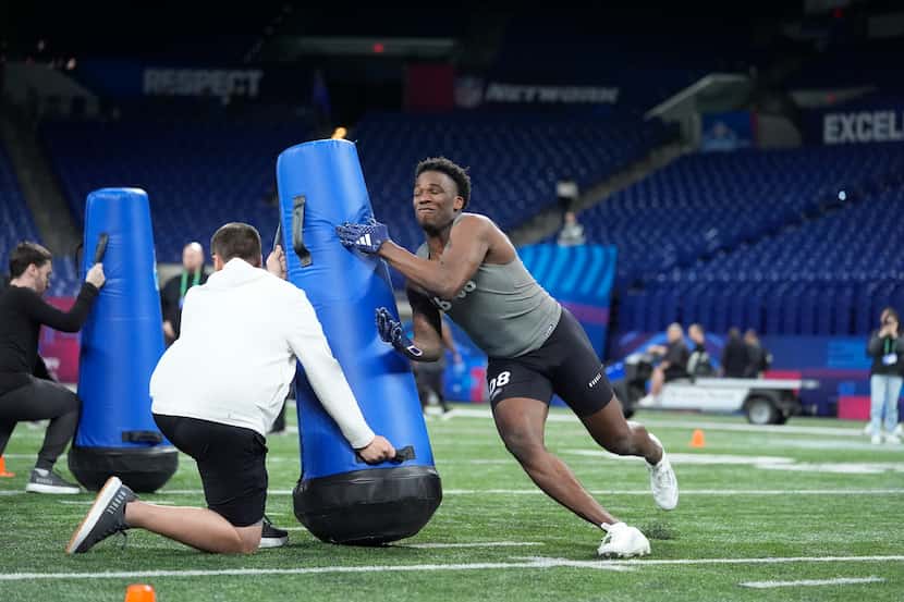Texas A&M linebacker Edgerrin Cooper ran a drill at the NFL football scouting combine on...