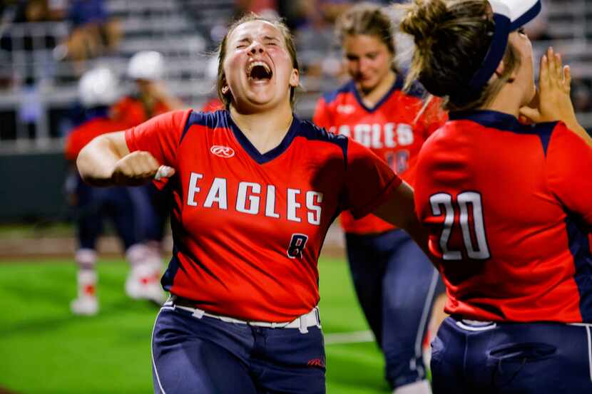 Allen's Taylor Wright (8) celebrates a two-run double by Celeste McCary during a four-run...