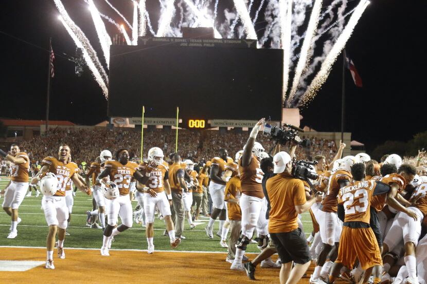 Fireworks light the sky after Texas quarterback Tyrone Swoopes (18) scored the winning...