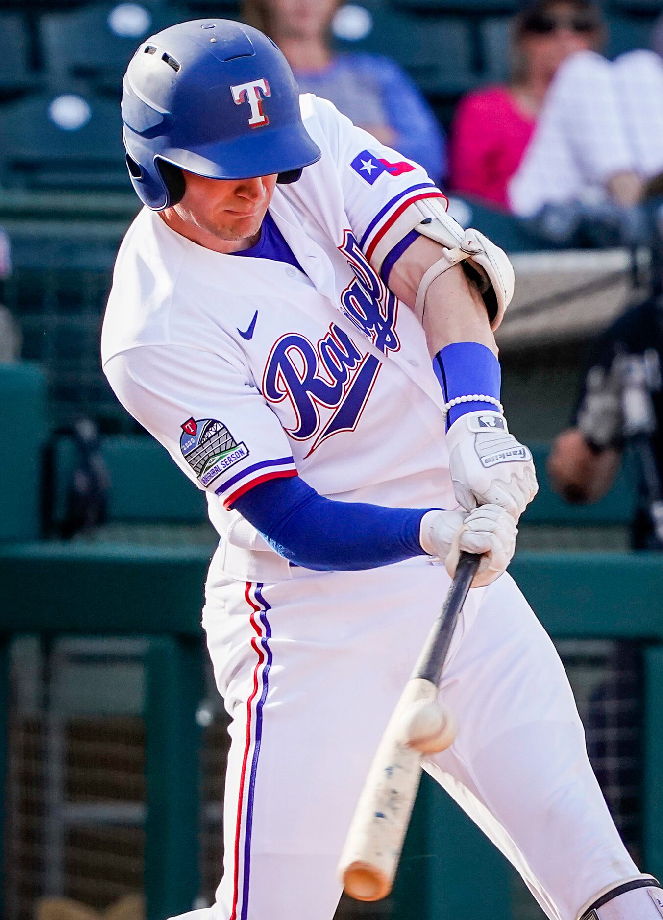 Texas Rangers first baseman Josh Altmann hits a triple during the eighth inning of a spring...