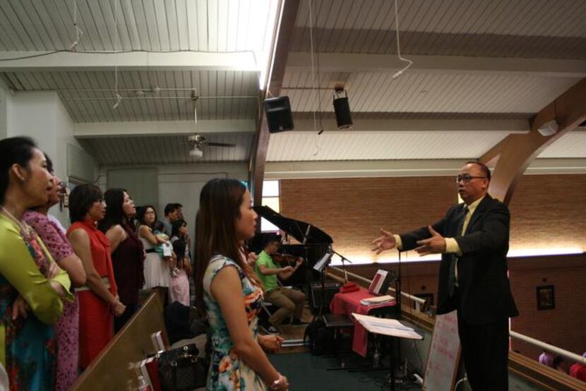 Conductor Ky M. Huynh directs the Ca Doan Emmanuel choir. The choir began in December of...