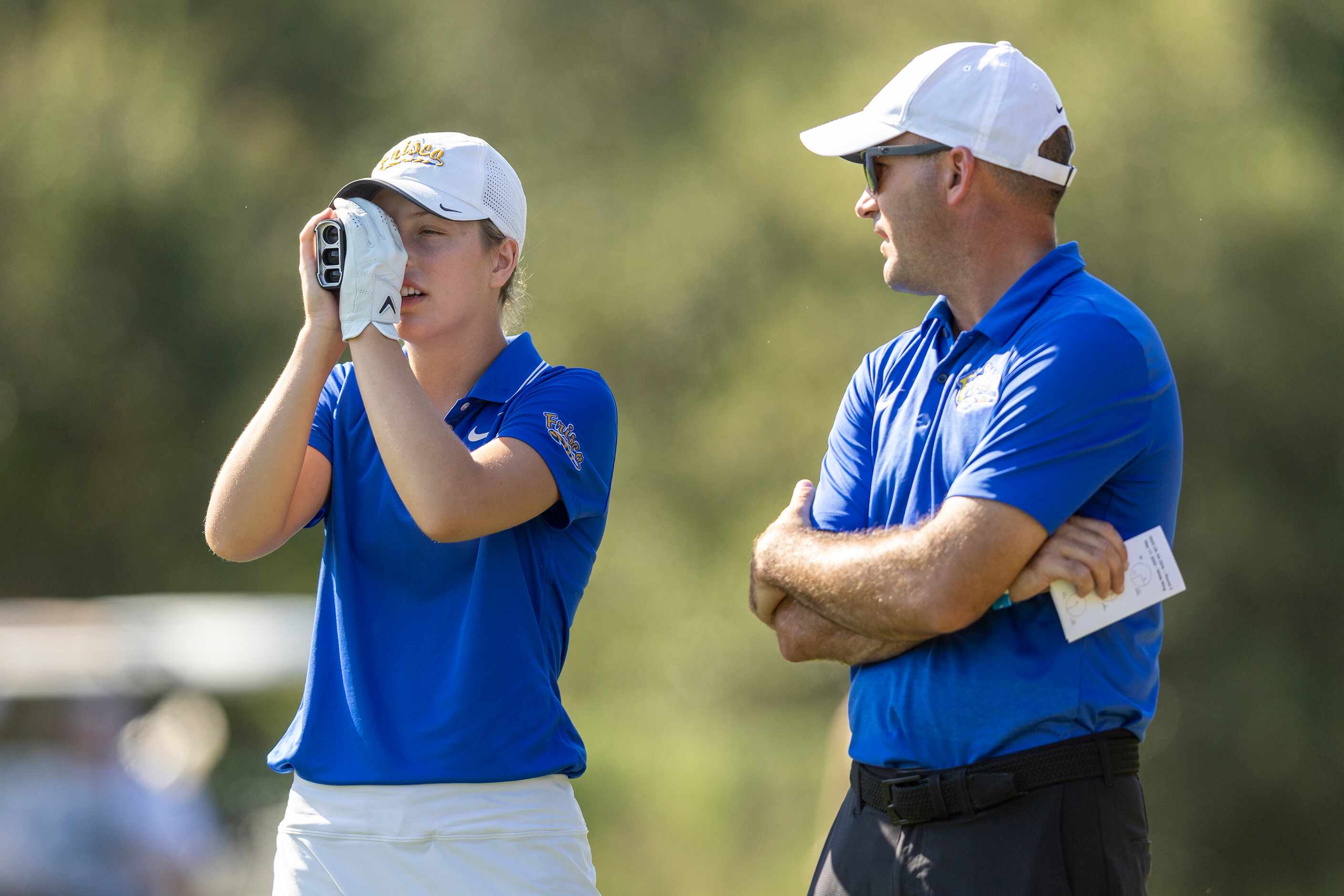 Frisco’s Queenie Guercio speaks to assistant coach Nathan Hopkins on the 3rd tee box during...
