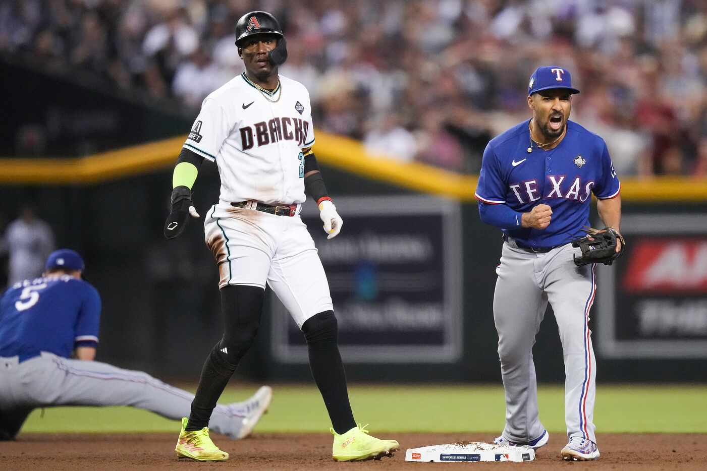 Texas Rangers second baseman Marcus Semien (right) celebrates turning a double play as...