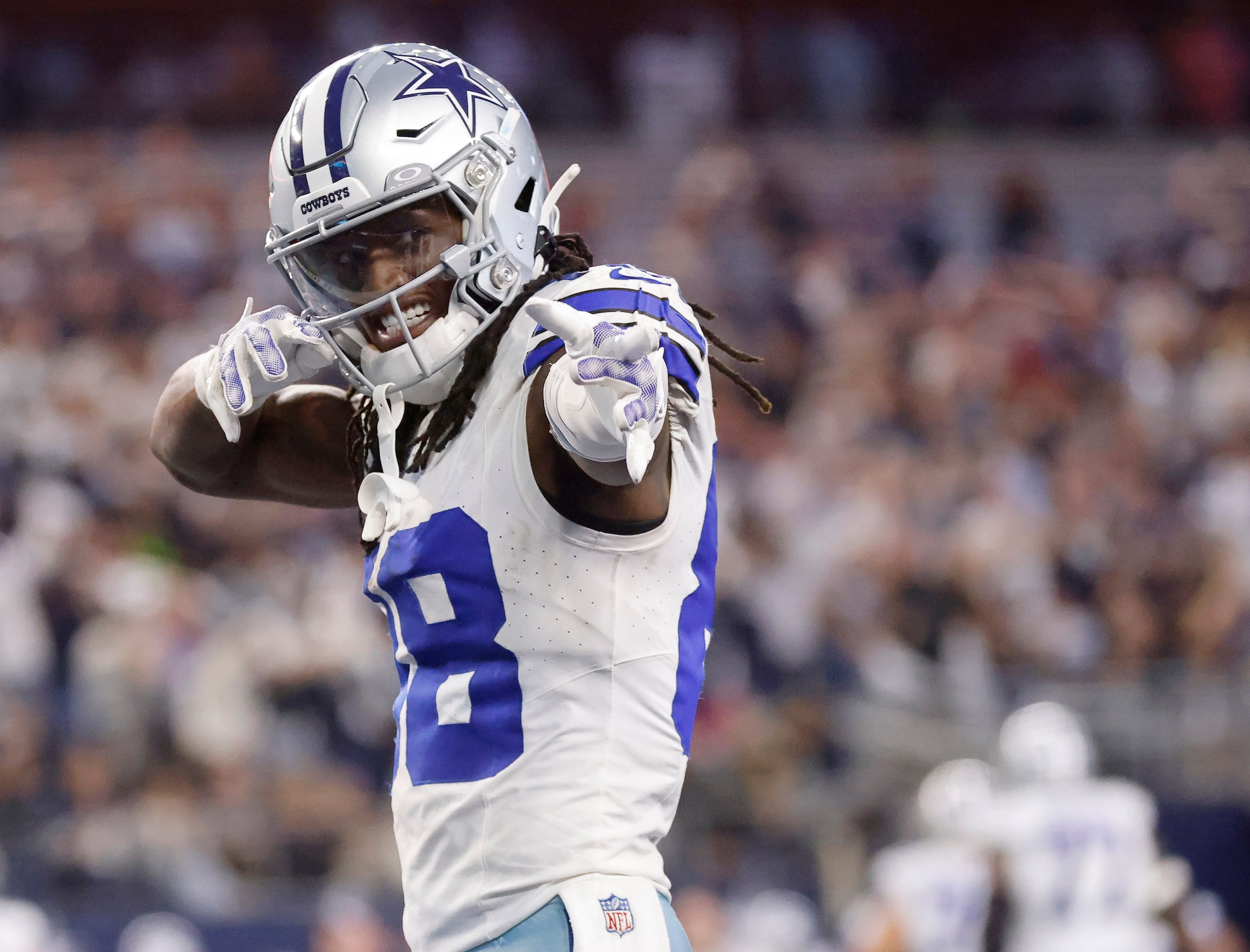 Dallas Cowboys wide receiver CeeDee Lamb (88) points to fellow receiver Brandin Cooks after...