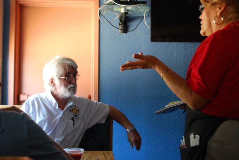 Daniel Long, left,  discusses his lunch order with Maria Vargas at Tino's Too Mexican...