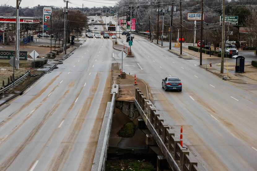 Ice and sand covered Garland Road in Dallas on Thursday, Feb. 24, 2022.
