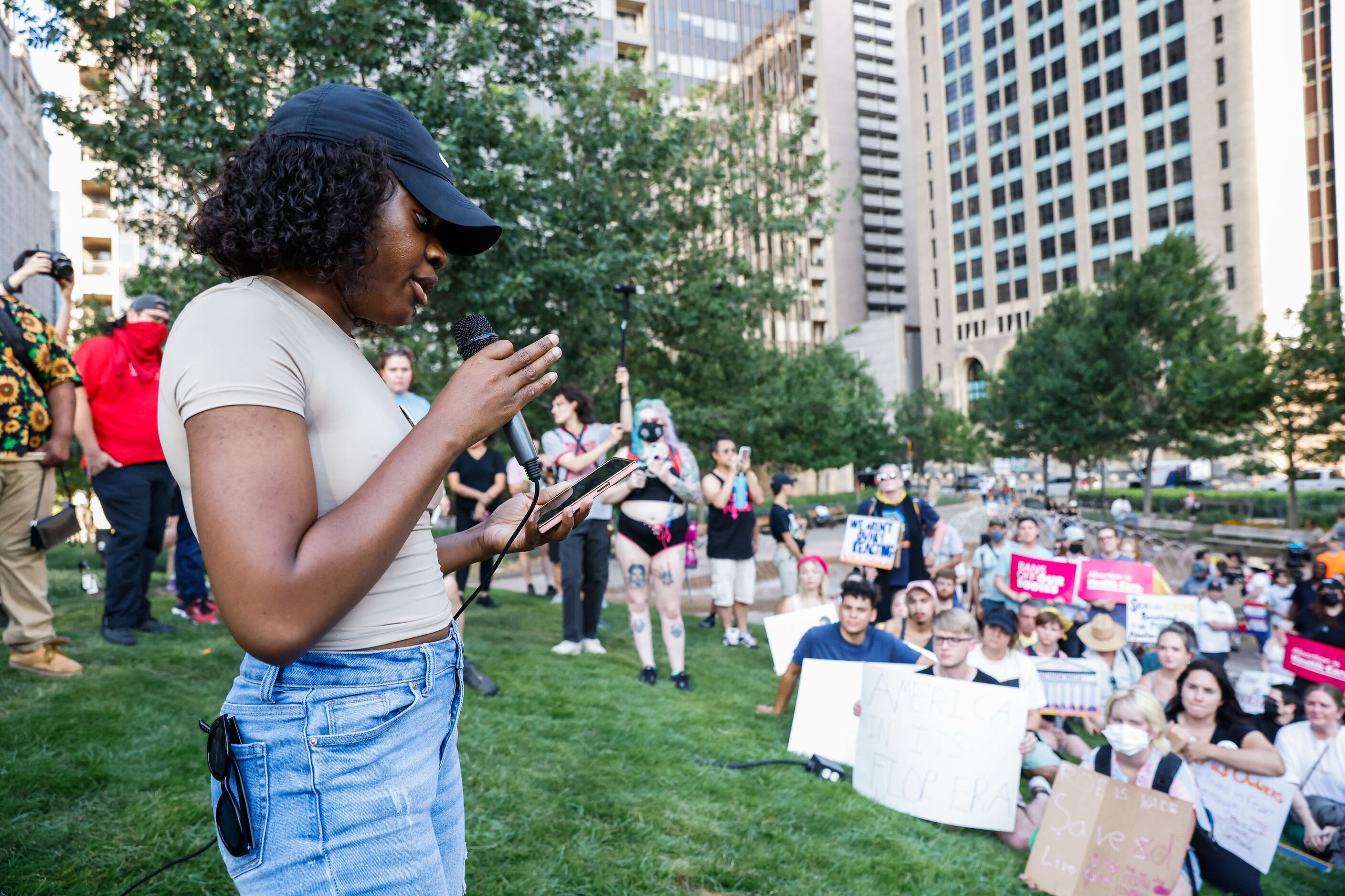 Uduak Nkanga from AFIYA Center addresses to a group of demonstrators at the Civic Garden in...