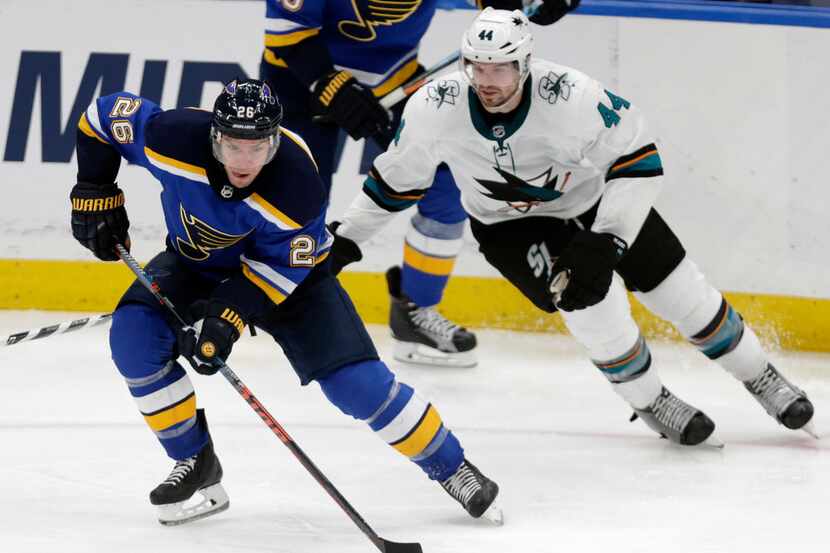 St. Louis Blues' Paul Stastny (26) controls the puck in front of San Jose Sharks'...