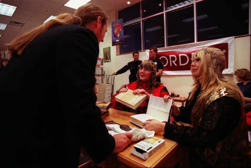 In 1996, author Anne Rice (center) is seen signing her book, 'The Servant of the Bones,' at...