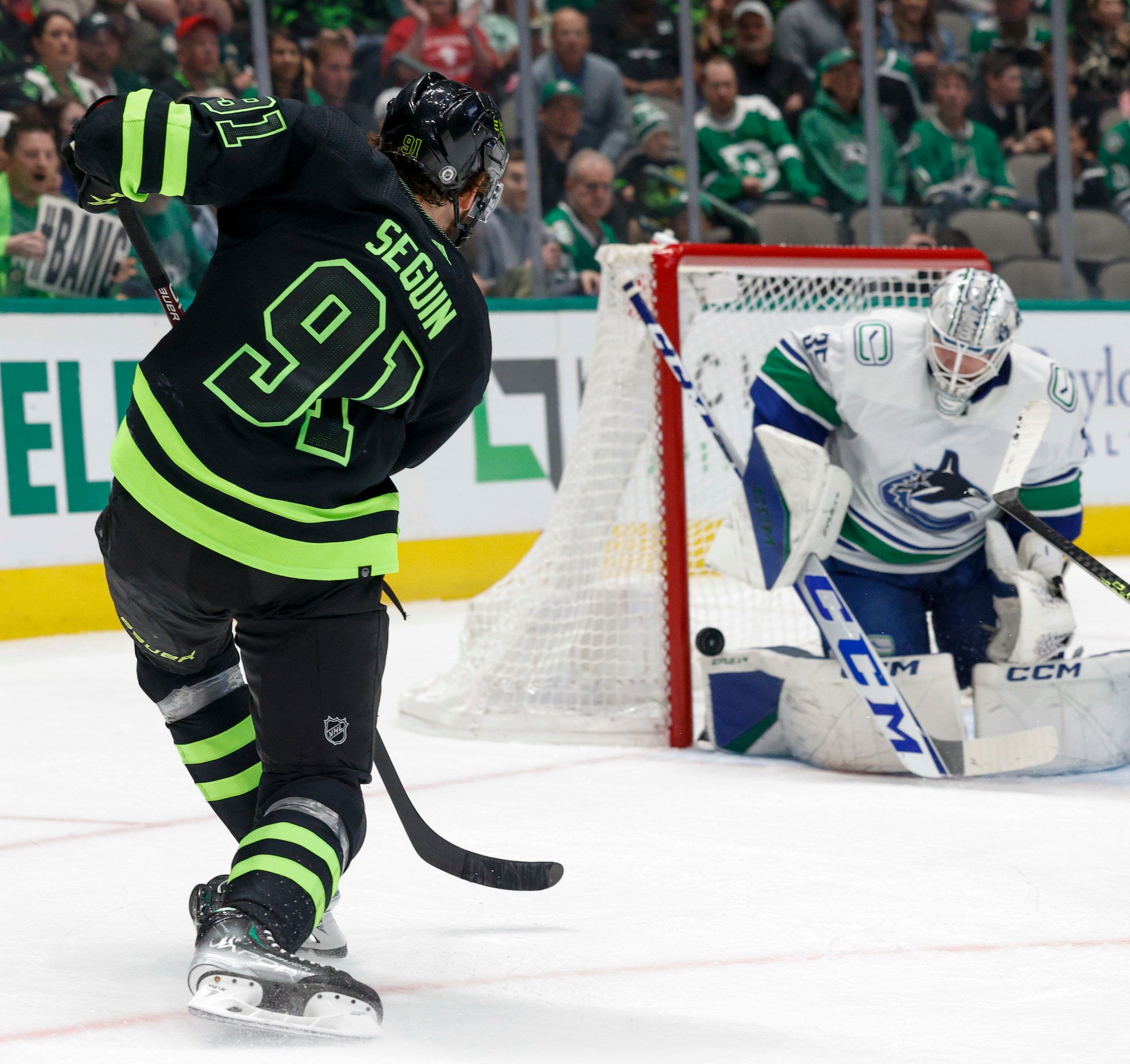 Vancouver Canucks goaltender Thatcher Demko (35) bucks a shot attempt from Dallas Stars...